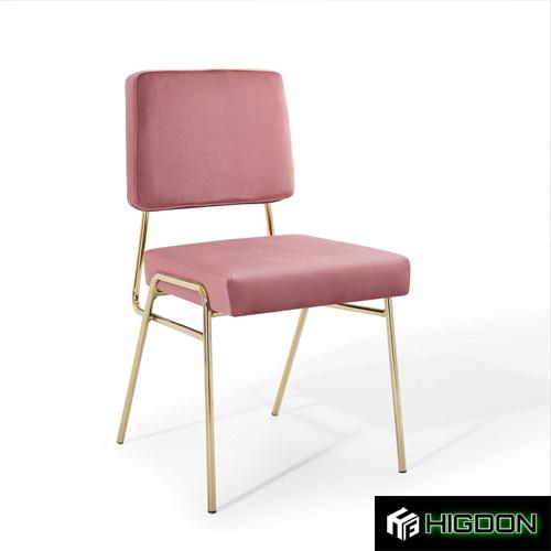 Armless pink velvet dining chair with golden metal feet