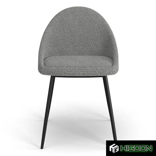 Stylish dark grey boucle dining chair with black metal feet