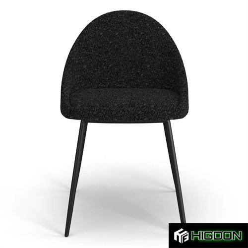 Sleek and stylish black boucle dining chair