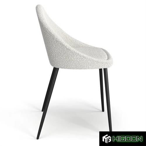 Stylish white boucle dining chair with metal feet