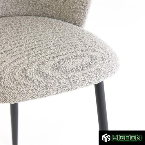 Curved back stylish grey boucle dining chair