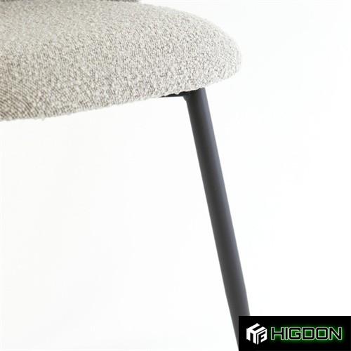 Curved back stylish grey boucle dining chair