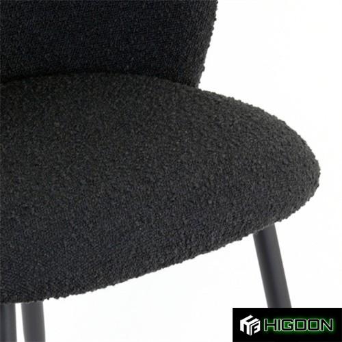 Curved back stylish black boucle dining chair