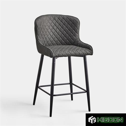 Grey upholstered bar stool with metal feet 
